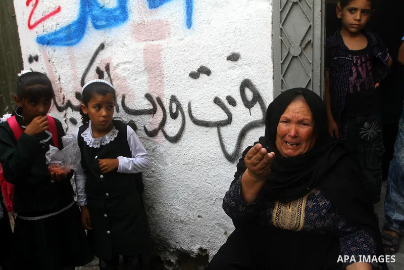 Relatives of the Palestinian Popular Resistance Committees militant, Khaled Abu Samhoud, who was killed in Israeli airstrike, mourn during his funeral in the southern Gaza Strip city of Khan Younis, on Sept. 7, 2011. A P...