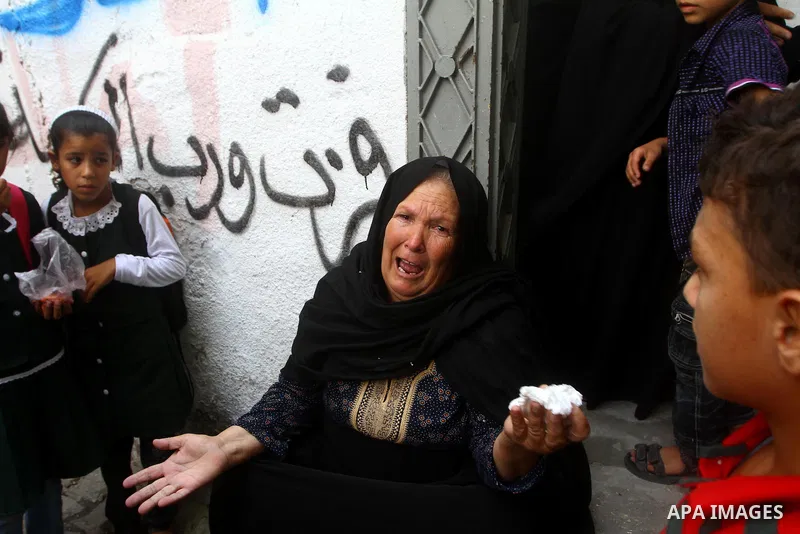 Relatives of the Palestinian Popular Resistance Committees militant, Khaled Abu Samhoud, who was killed in Israeli airstrike, mourn during his funeral in the southern Gaza Strip city of Khan Younis, on Sept. 7, 2011. A P...