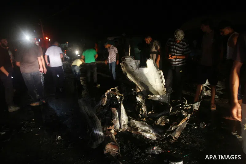 Palestinians check the damage to a car after an Israeli attack in Deir al-Balah in the central Gaza Strip on September 7, 2011. The hardline Islamic Jihad group said that the dead man, Remah al-Hasani, was a member of it...