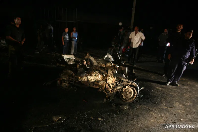 Palestinians check the damage to a car after an Israeli attack in Deir al-Balah in the central Gaza Strip on September 7, 2011. The hardline Islamic Jihad group said that the dead man, Remah al-Hasani, was a member of it...