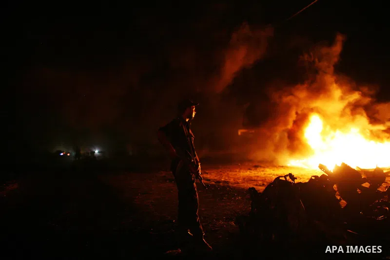 Palestinians check the damage to a car after an Israeli attack in Deir al-Balah in the central Gaza Strip on September 7, 2011. The hardline Islamic Jihad group said that the dead man, Remah al-Hasani, was a member of it...