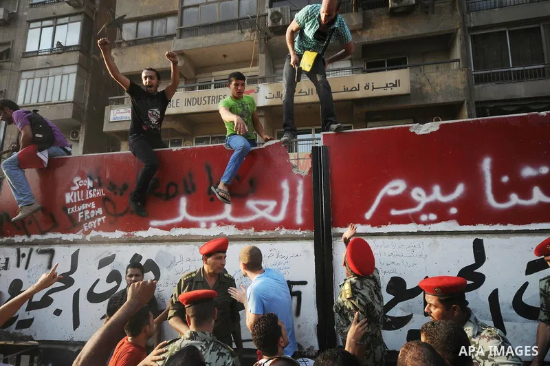 Egyptian protesters dismantle the concrete wall which was built in front of the Israeli embassy, in Cairo, Egypt, 09 September 2011. Security forces had built the wall in an attempt to secure the embassy after a series o...