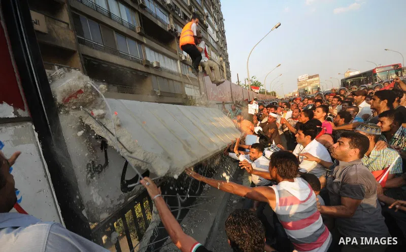 Egyptian protesters dismantle the concrete wall which was built in front of the Israeli embassy, in Cairo, Egypt, 09 September 2011. Security forces had built the wall in an attempt to secure the embassy after a series o...