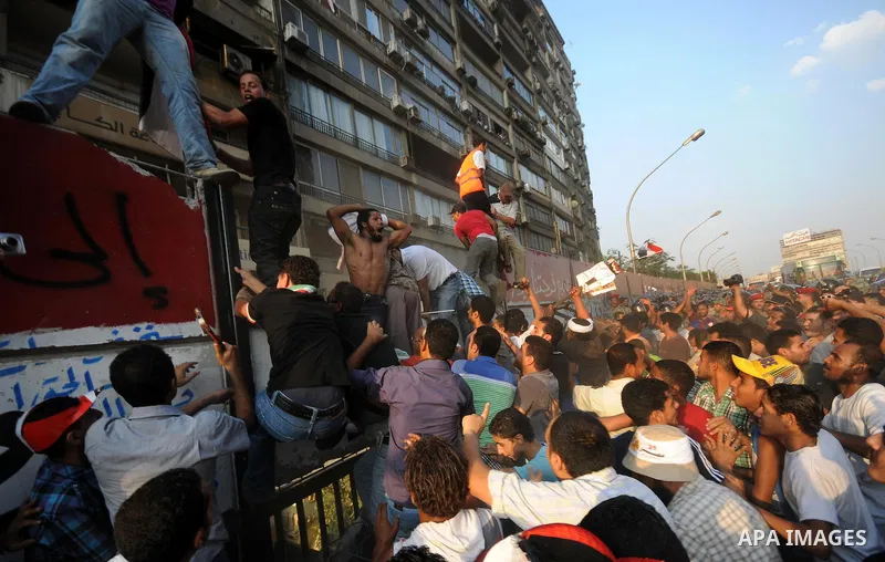 Egyptian protesters dismantle the concrete wall which was built in front of the Israeli embassy, in Cairo, Egypt, 09 September 2011. Security forces had built the wall in an attempt to secure the embassy after a series o...