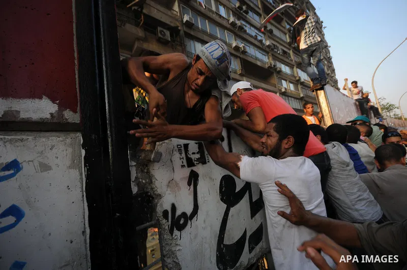 Egyptian protesters dismantle the concrete wall which was built in front of the Israeli embassy, in Cairo, Egypt, 09 September 2011. Security forces had built the wall in an attempt to secure the embassy after a series o...