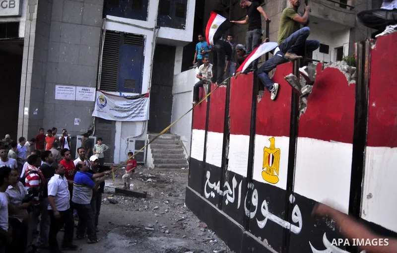 Egyptian protesters dismantle the concrete wall which was built in front of the Israeli embassy, in Cairo, Egypt, 09 September 2011. Security forces had built the wall in an attempt to secure the embassy after a series o...