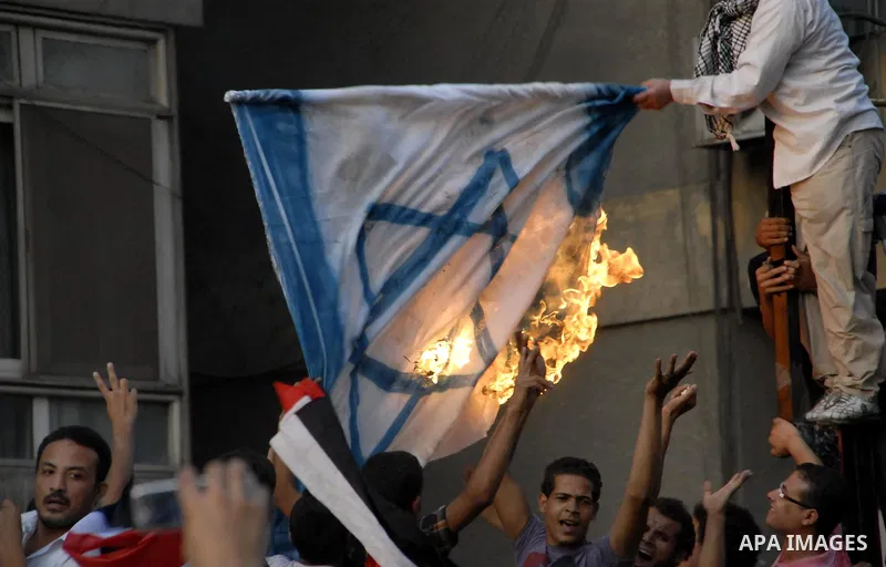 Egyptian protesters dismantle the concrete wall which was built in front of the Israeli embassy, in Cairo, Egypt, 09 September 2011. Security forces had built the wall in an attempt to secure the embassy after a series o...