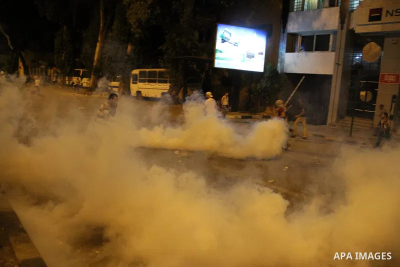Egyptian demonstrators clash with police early on September 10, 2011 outside the Israeli embassy in Cairo after protesters raided the building. Photo by Ahmed Asad