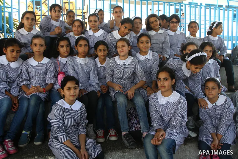 Palestinian students crammed in the schools of Relief and Works Agency refugees "UNRWA" studying at the "containers" made of tin because of overcrowding and the inability to accommodate large numbers of students in Gaza...