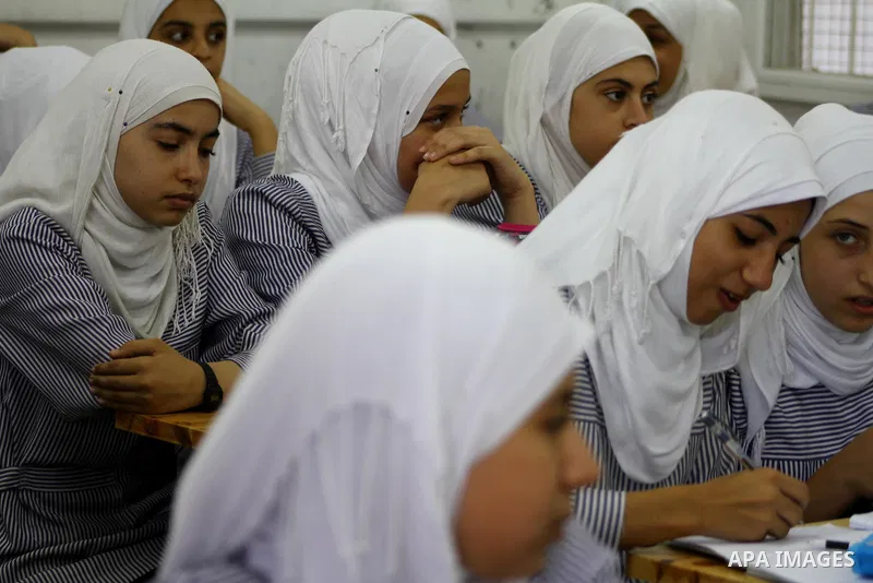 Palestinian students crammed in the schools of Relief and Works Agency refugees "UNRWA" studying at the "containers" made of tin because of overcrowding and the inability to accommodate large numbers of students in Gaza...