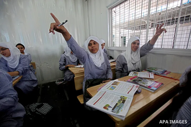 Palestinian students crammed in the schools of Relief and Works Agency refugees "UNRWA" studying at the "containers" made of tin because of overcrowding and the inability to accommodate large numbers of students in Gaza...