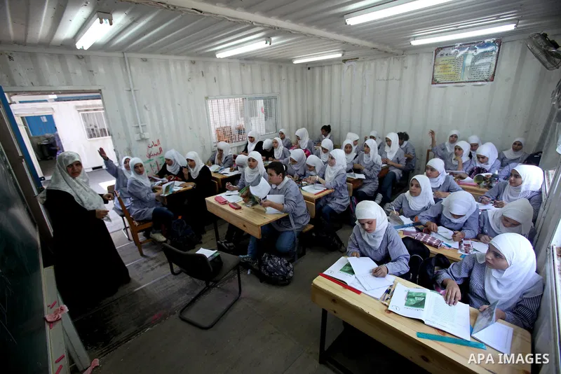 Palestinian students crammed in the schools of Relief and Works Agency refugees "UNRWA" studying at the "containers" made of tin because of overcrowding and the inability to accommodate large numbers of students in Gaza...