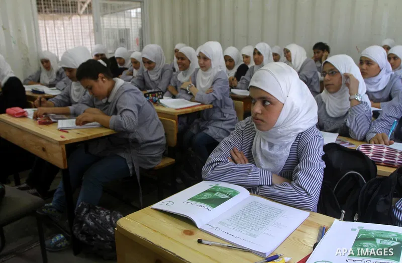 Palestinian students crammed in the schools of Relief and Works Agency refugees "UNRWA" studying at the "containers" made of tin because of overcrowding and the inability to accommodate large numbers of students in Gaza...