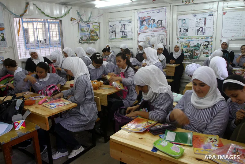 Palestinian students crammed in the schools of Relief and Works Agency refugees "UNRWA" studying at the "containers" made of tin because of overcrowding and the inability to accommodate large numbers of students in Gaza...