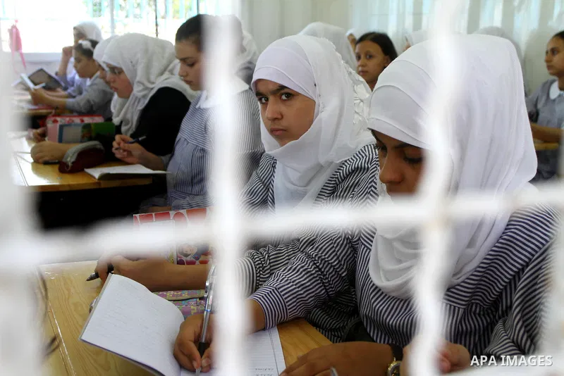Palestinian students crammed in the schools of Relief and Works Agency refugees "UNRWA" studying at the "containers" made of tin because of overcrowding and the inability to accommodate large numbers of students in Gaza...