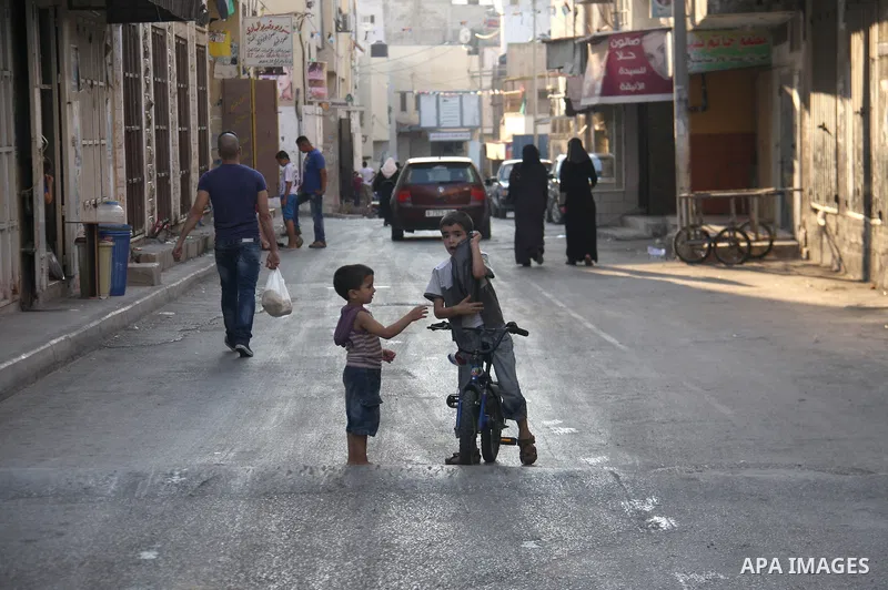 Palestinians children play inside the Jenin refugee camp in the West Bank city of Jenin on Sep. 12, 2011. Photo by Wagdi Eshtayah