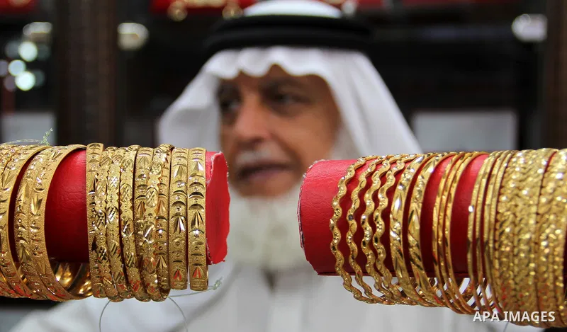 A Palestinian goldsmith displays Chinese jewellery at a jewellery shop in the southern Gaza Strip town of Rafah on September 12, 2011. The price of the Chinese gold is 15 dollars instead of 50 dollars for the other origi...