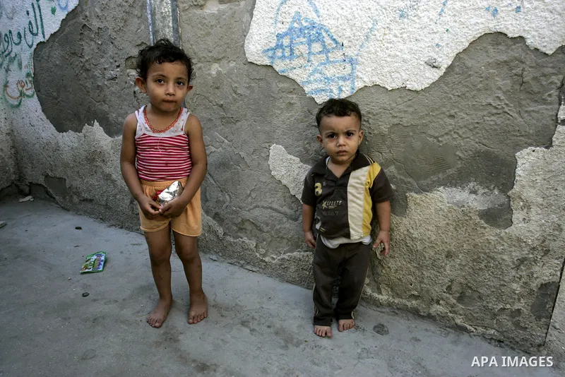 Palestinian children stand in the street in the Rafah Refugee Camp, Southern Gaza Strip on September 13, 2011. A diplomatic showdown looms at the United Nations this month when Palestinian President Mahmoud Abbas is expe...
