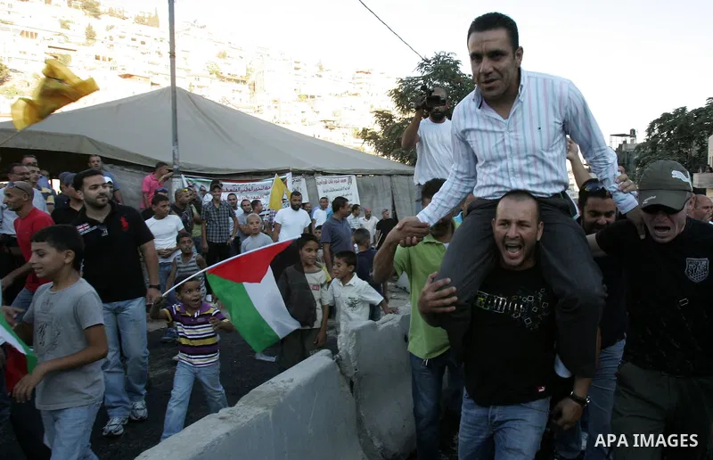 A Palestinian freed prisoner, Adnan Gheith is welcomed by his relatives in the east Jerusalem neighborhood of Silwan on Sep. 13, 2011 after he was released from an Israeli jails. Photo by Mahfouz Abu Turk