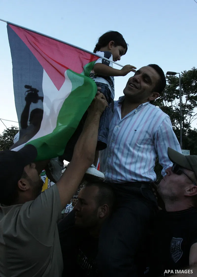 A Palestinian freed prisoner, Adnan Gheith is welcomed by his relatives in the east Jerusalem neighborhood of Silwan on Sep. 13, 2011 after he was released from an Israeli jails. Photo by Mahfouz Abu Turk