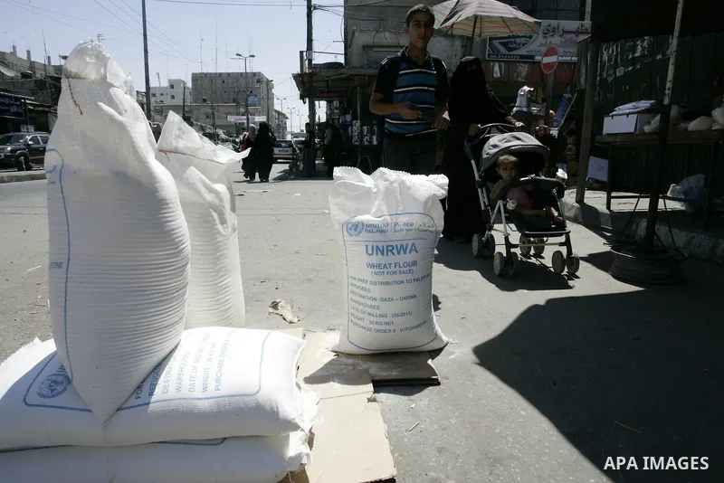 Palestinians receive their food aid from a UN distribution centre in the Rafah refugee camp, southern Gaza Strip on Sep. 14, 2011. Germany provided for the first time a donation to the school's nutrition program, and the...