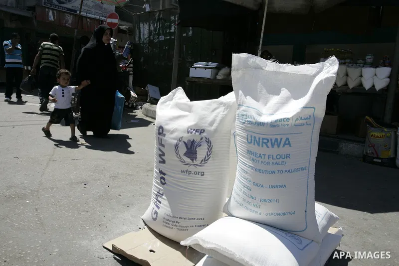 Palestinians receive their food aid from a UN distribution centre in the Rafah refugee camp, southern Gaza Strip on Sep. 14, 2011. Germany provided for the first time a donation to the school's nutrition program, and the...
