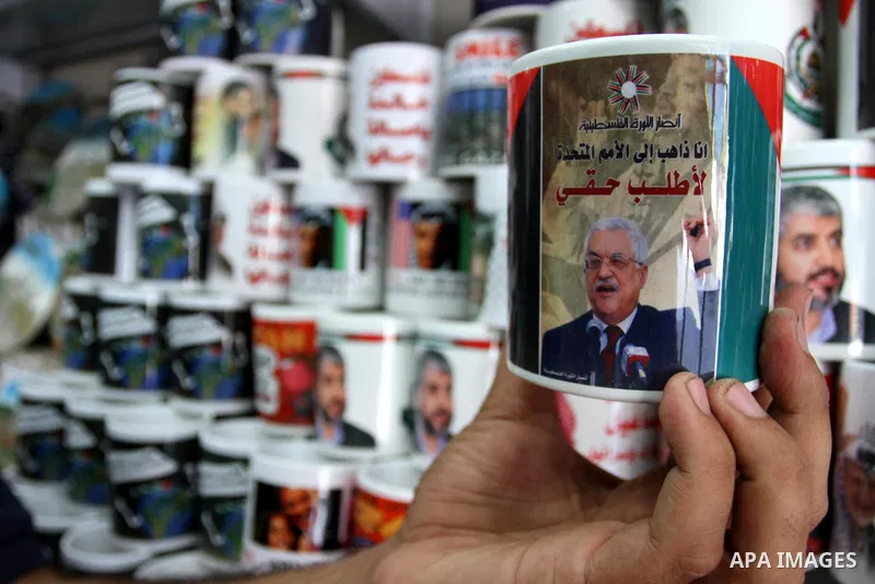 Coffee mugs stand for sale at a souvenirs shop, with a printed picture of the Palestinian President Mahmoud Abbas (Abu Mazen) in Gaza City, on Sep. 15, 2011 as the Palestinians prepare to submit a formal request to becom...