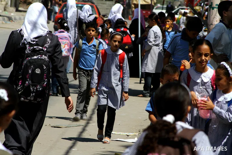 Palestinian students walk in the streets at al-Shate` refugee camp in Gaza City, on Sep. 15, 2011. President Mahmoud Abbas's bid to seek U.N. recognition of a Palestinian state is not generating much enthusiasm in the is...