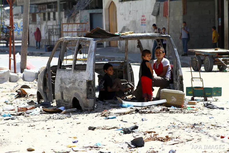 Palestinian children play inside old car in al-Shate` refugee camp in Gaza City, on Sep. 15, 2011. President Mahmoud Abbas's bid to seek U.N. recognition of a Palestinian state is not generating much enthusiasm in the is...
