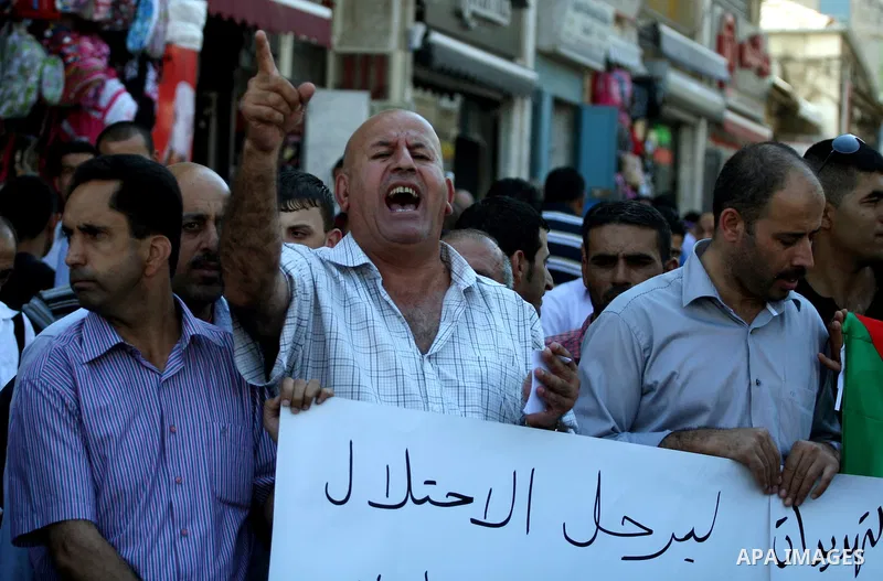 Palestinians take part in an anti-US demonstration in the West Bank city of Ramallah on September 15, 2011. Dozens of Palestinians chanted slogans against the pressure by the US government on the Palestinian Authority to...