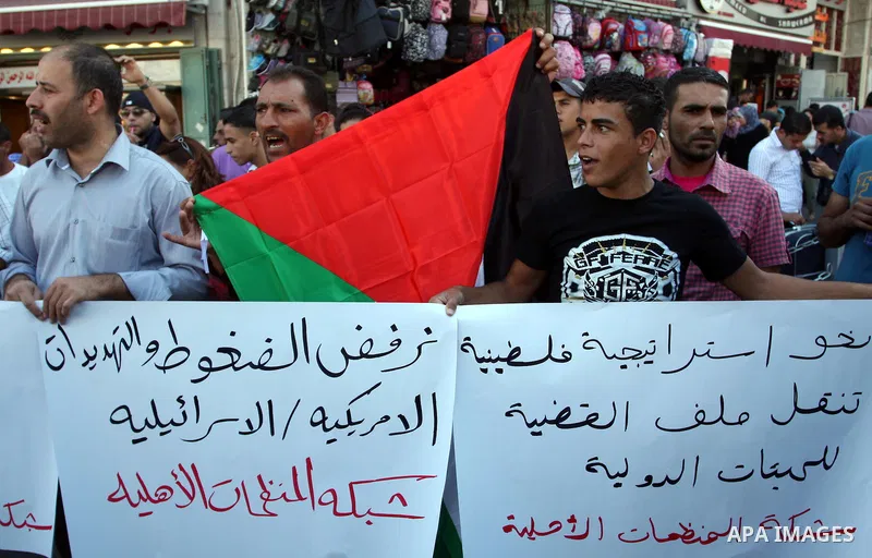 Palestinians take part in an anti-US demonstration in the West Bank city of Ramallah on September 15, 2011. Dozens of Palestinians chanted slogans against the pressure by the US government on the Palestinian Authority to...