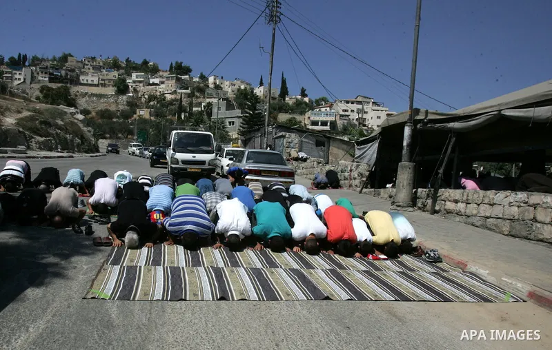 Palestinians attend Friday prayers at the protest tent in the Silwan neighborhood in East Jerusalem on Sep.16,2011 as Palestinian protesters gather for a demonstration. Photo by Mahfouz Abu Turk