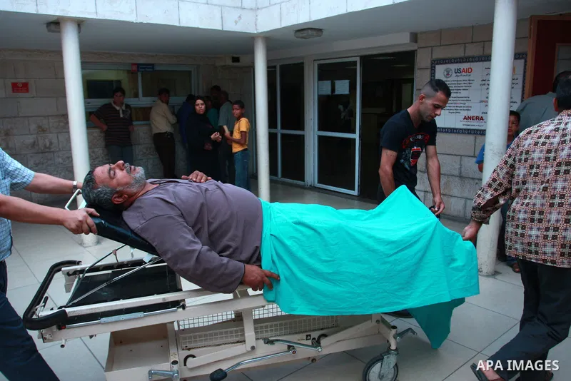 Mahmoud Abu Reiade, a Palestinian who was wounded in a confrontation with Israeli settlers in the village of Qusra, is brought to a hospital in the West Bank city of Nablus, Friday, Sept. 16, 2011. Israeli settlers assau...