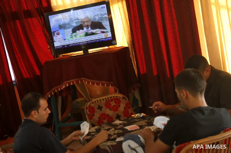 Customers in a Gaza coffee shopl watch TV as Palestinian Authority President Mahmud Abbas delivers a key speech ahead of the UN general assembly on September 16, 2011. Abbas said Palestinians are going to Security Counci...