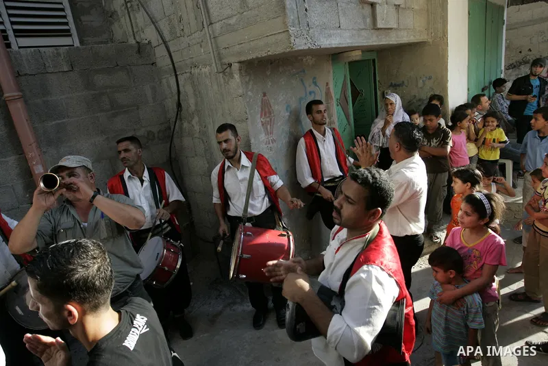 Palestinian friends and relatives celebrated the groom, Mohamed Gouda 24 years old, in the Rafah refugee camp, southern Gaza Strip on the eve of his wedding on Sep. 16, 2011, during the traditional celebration, Gouda was...