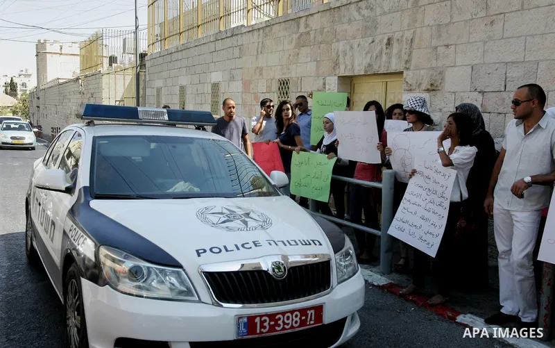 Palestinian women, joined by foreign peace activists and left-wing Israelis, hold up placards calling for a Palestinian state with full UN membership during a protest in Jerusalem, on 17 September 2011. Palestine is set...