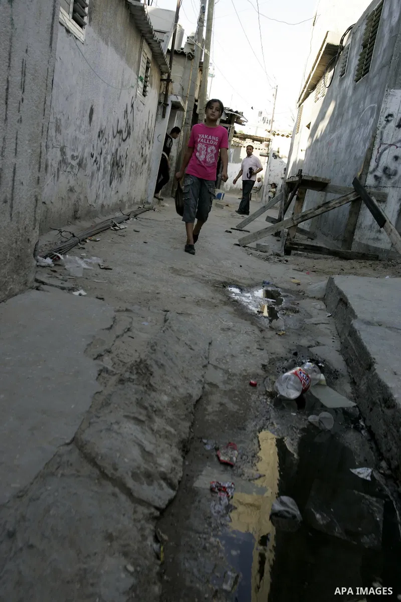 A Palestinian girl walks outside her house at Rafah refugee camp, southern Gaza Strip on Sep. 17, 2011. The Palestinians are preparing to submit a formal request to become the 194th member of the United Nations when the...