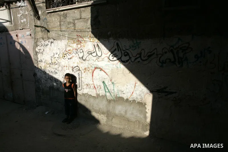 A Palestinian boy stands outside his house at Rafah refugee camp, southern Gaza Strip on Sep. 17, 2011. The Palestinians are preparing to submit a formal request to become the 194th member of the United Nations when the...