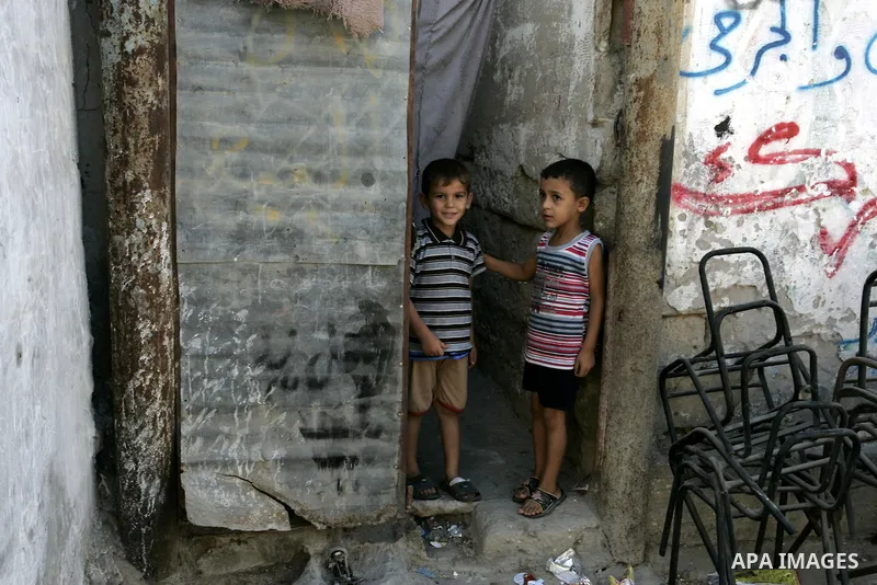 Palestinian children stand outside their house at Rafah refugee camp, southern Gaza Strip on Sep. 17, 2011. The Palestinians are preparing to submit a formal request to become the 194th member of the United Nations when...
