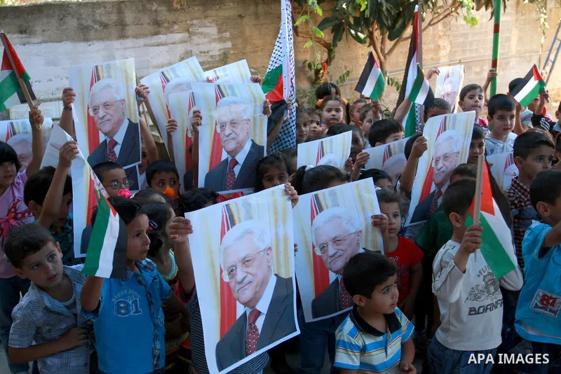 Palestinian children hold posters, in support with the Palestinian President Mahmoud Abbas, during a rally in the village of Azmut in the West Bank city of Nablus, on Sept. 18, 2011. Palestinian President Mahmoud Abbas i...