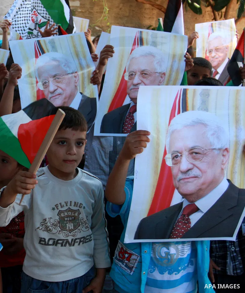 Palestinian children hold posters, in support with the Palestinian President Mahmoud Abbas, during a rally in the village of Azmut in the West Bank city of Nablus, on Sept. 18, 2011. Palestinian President Mahmoud Abbas i...