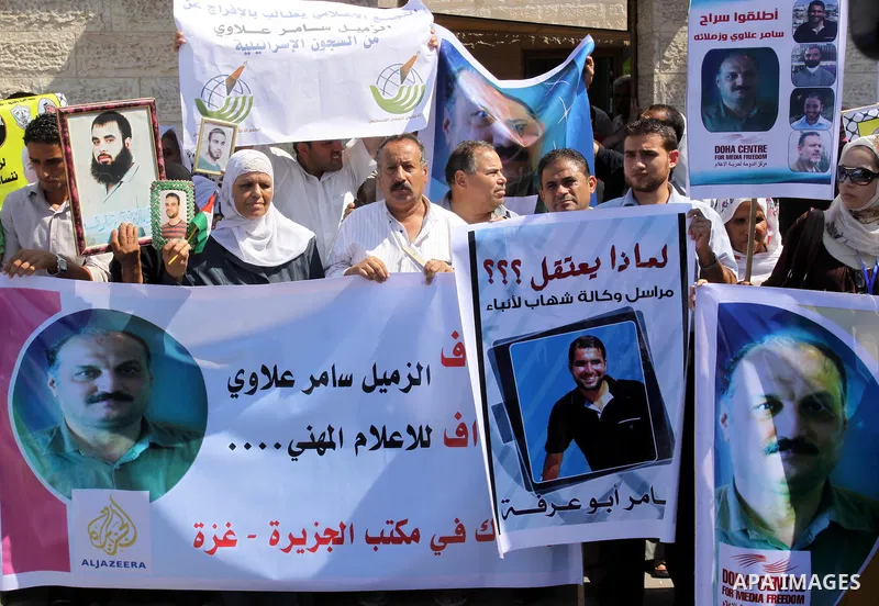 Palestinian Journalists and the relatives of prisoners take part during a protest in support with the journalist Samir Allawi, Al-Jazeera correspondent detained by the occupation, and calling for the release of the priso...
