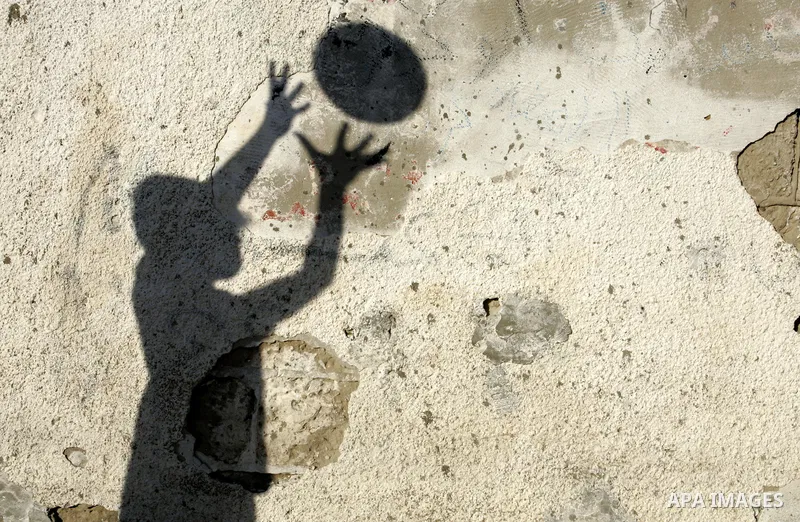 A shadow of a Palestinian boy plays football in the Rafah refugee camp, southern Gaza Strip on Sep. 19, 2011. Attend the 66th General Assembly session of United Nations, which begins Tuesday, Sep. 20. The United States a...