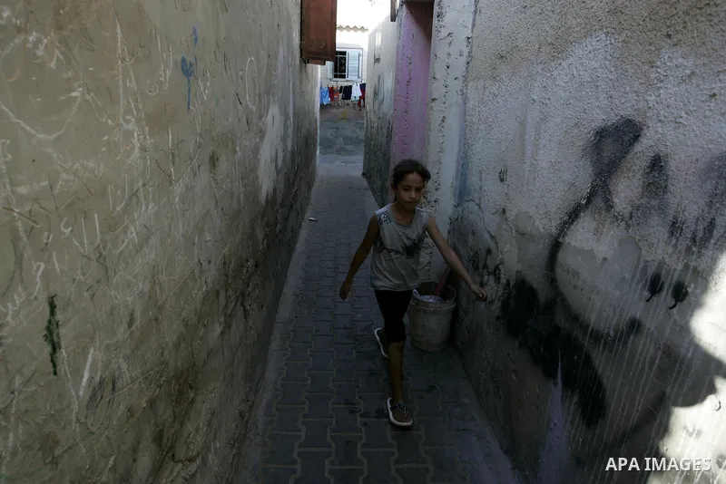 A Palestinian girl walks in the Rafah refugee camp, southern Gaza Strip on Sep. 19, 2011. Attend the 66th General Assembly session of United Nations, which begins Tuesday, Sep. 20. The United States and Europe scrambled...