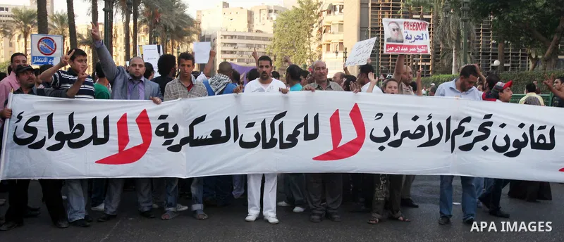 Hundreds of Egyptian activists marched in downtown Cairo to protest against the reassertion of the Emergency Law in the wake of the attack on the Israeli Embassy on 9 September. Egyptian activists marching through the st...