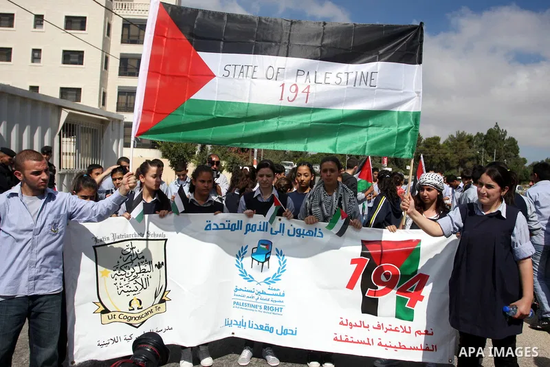 Palestinians march during a rally to support the Palestinian statehood bid in the United Nations, in the West Bank city of Ramallah, on Sept. 20, 2011. The Palestinians brushed aside heated Israeli objections and a promi...