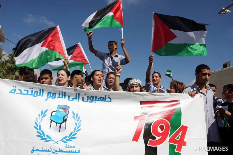 Palestinians march during a rally to support the Palestinian statehood bid in the United Nations, in the West Bank city of Ramallah, on Sept. 20, 2011. The Palestinians brushed aside heated Israeli objections and a promi...