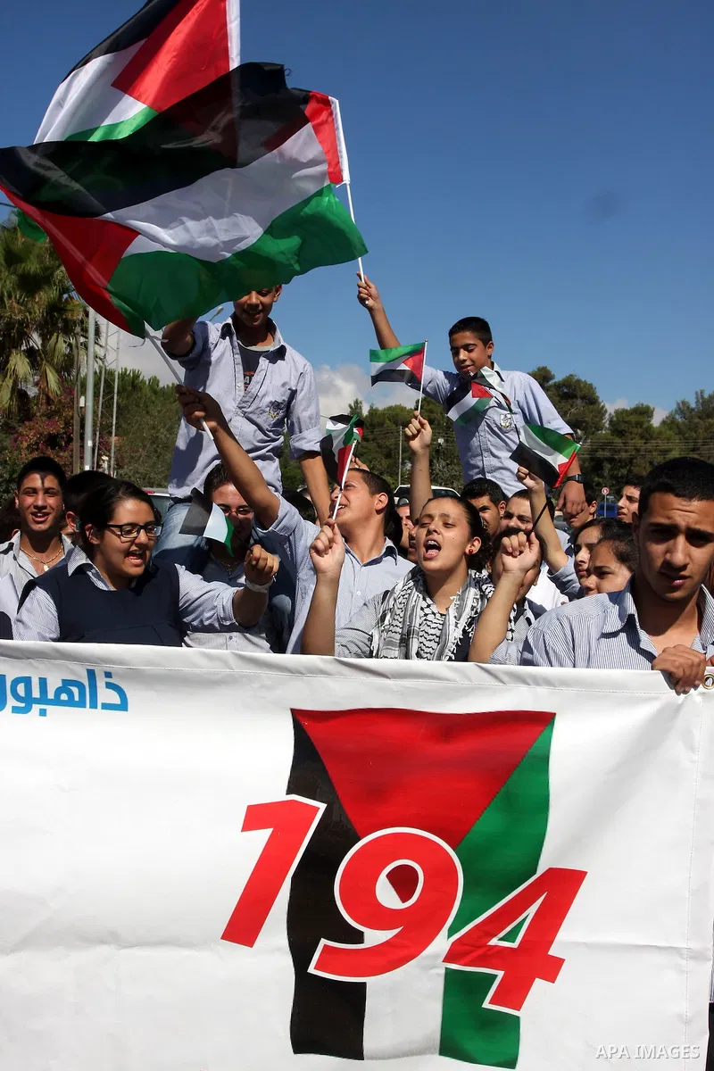 Palestinians march during a rally to support the Palestinian statehood bid in the United Nations, in the West Bank city of Ramallah, on Sept. 20, 2011. The Palestinians brushed aside heated Israeli objections and a promi...