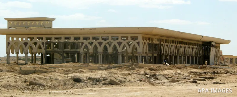 A Palestinian walks the rubble of the Gaza International Airport in Rafah in the southern Gaza Strip, on September 20, 2011. The 70-million-dollar airport which opened in November 1998 has been closed since February 2001...