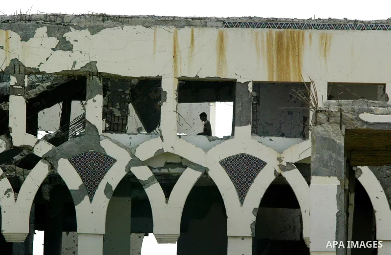 A Palestinian walks the rubble of the Gaza International Airport in Rafah in the southern Gaza Strip, on September 20, 2011. The 70-million-dollar airport which opened in November 1998 has been closed since February 2001...